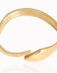 Adele Dejak Anele Brass Bracelet – Handcrafted African-inspired accessory made from recycled brass, featuring a bold, contemporary design with a polished gold finish. Sustainable luxury piece, ethically crafted in Kenya, embodying modern elegance and cultural heritage-wide angle view