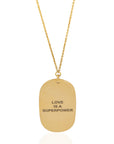 Handcrafted Anita 'Love Is a Superpower' neckpiece by Adele Dejak, featuring a bold, minimalist pendant cast in recycled brass; a statement of empowerment and African-inspired elegance-front view