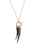 Jelani Neckpiece: earthy brass chain with horn pendants for daring, exotic allure-close up view