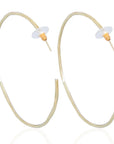 Jojo Earrings: minimalist brass elegance, artisan-crafted for serene, refined style-over head view