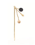 Handcrafted Asami Hairpin by Adele Dejak, featuring recycled brass and Ankole cow horn in a minimalist design with dangling discs, reflecting African heritage and sustainable luxury-front angle view