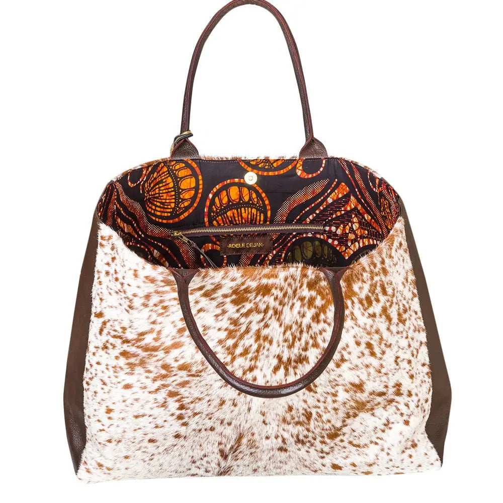 Spacious African wax bag, versatile weekend essential, magnetic closure, chic sophistication, travel-ready-exterior view