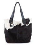 Fara Hide Bag: ethically sourced, evocative, and radiant with upcycled brass and African wax print
