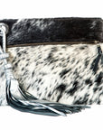 Yanga Spice Clutch: ethically crafted, tassel-detailed wristlet with heartfelt charm-side view