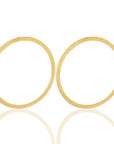 Round zofia brass earrings symbolizing resilience, ideal for birthdays or adding charm to evening outfits-front view