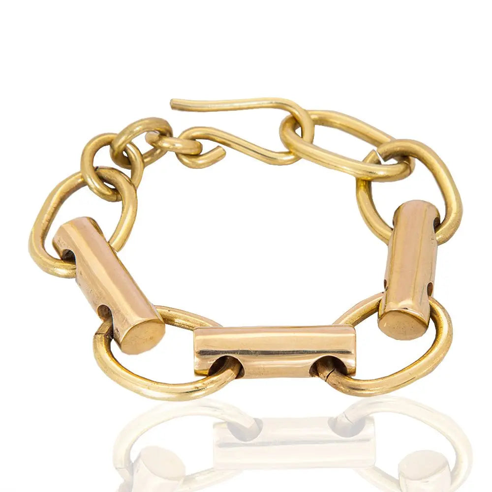 ZUBERI-BRASS-BRACELET modern chunky bracelet evoking courage and bold self-expression-over head view