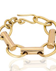ZUBERI-BRASS-BRACELET modern chunky bracelet evoking courage and bold self-expression-over head view