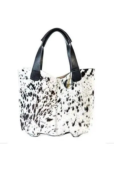 Fara Hide Bag: ethically sourced, evocative, and radiant with upcycled brass and African wax print-side view