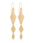 Folupia Hanging Earrings: eco-conscious brass, flowing charm, cultural allure, perfect for refined evenings-close up view