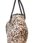 Mrembo Hide Bag: ethically sourced, enduring beauty with African wax print interior-diagonal view