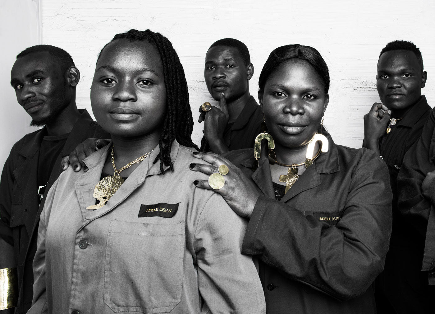 Adele Dejak team members wearing Adele Dejak handmade African inspired recycled brass bold statement jewellery pieces.